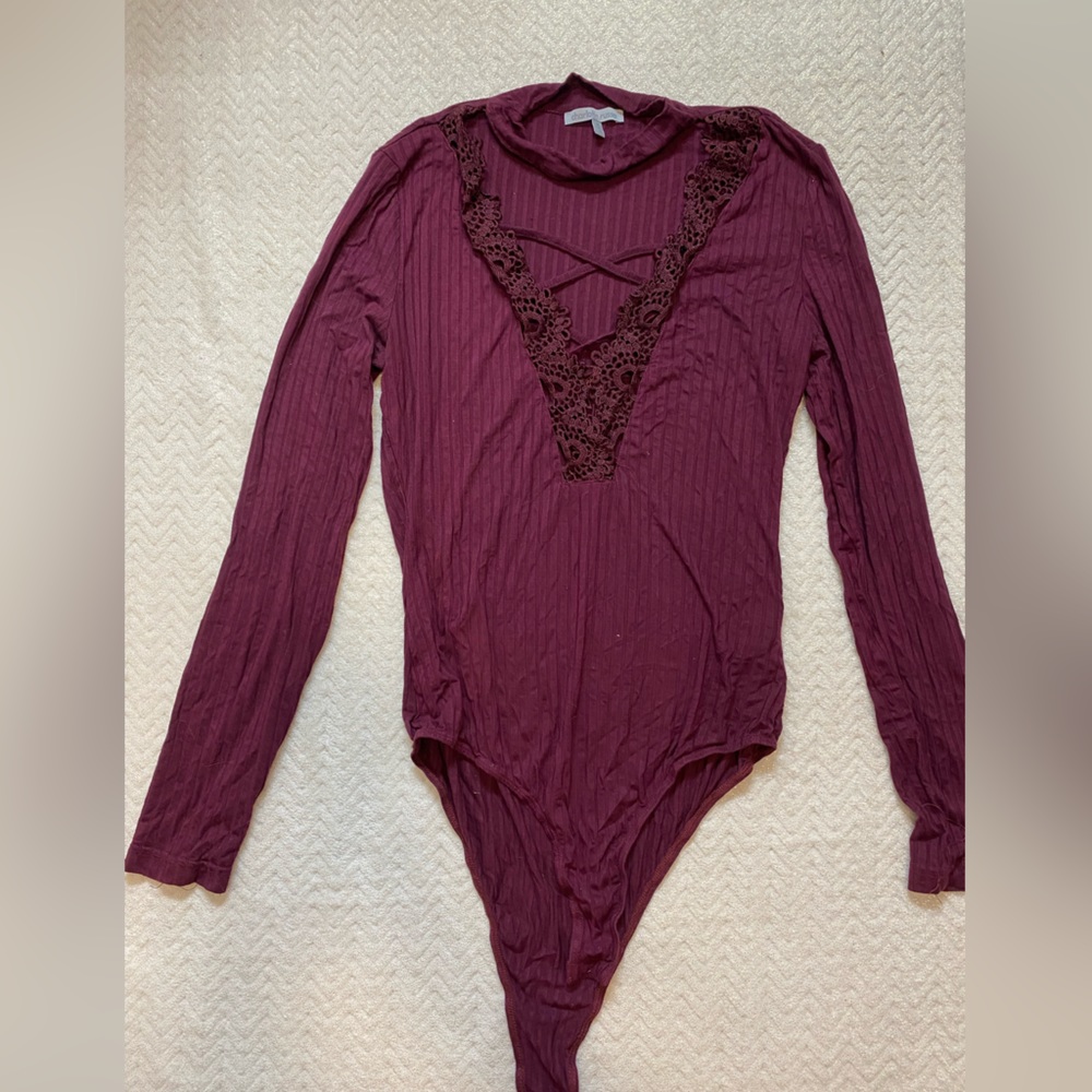 Charlotte Russe lace up front long sleeve body suit